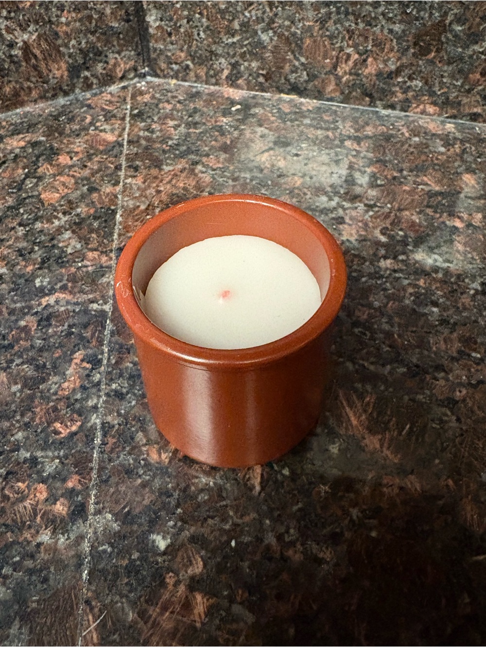 Handmade upcycled candle made by me, vanilla scented wax poured into a small jar